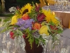 Rustic pail with sunflowers hydrangea roses